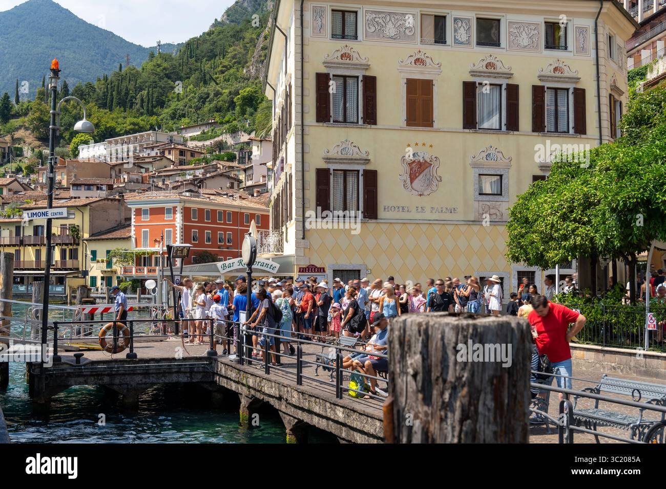 torbole-lake-garda-italy-20-july-2025-tourists-throng-the-jetty-at