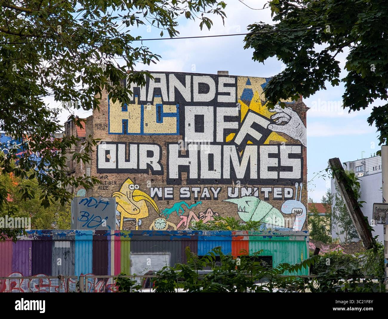 A large protest mural on the side of the alternative housing project ...
