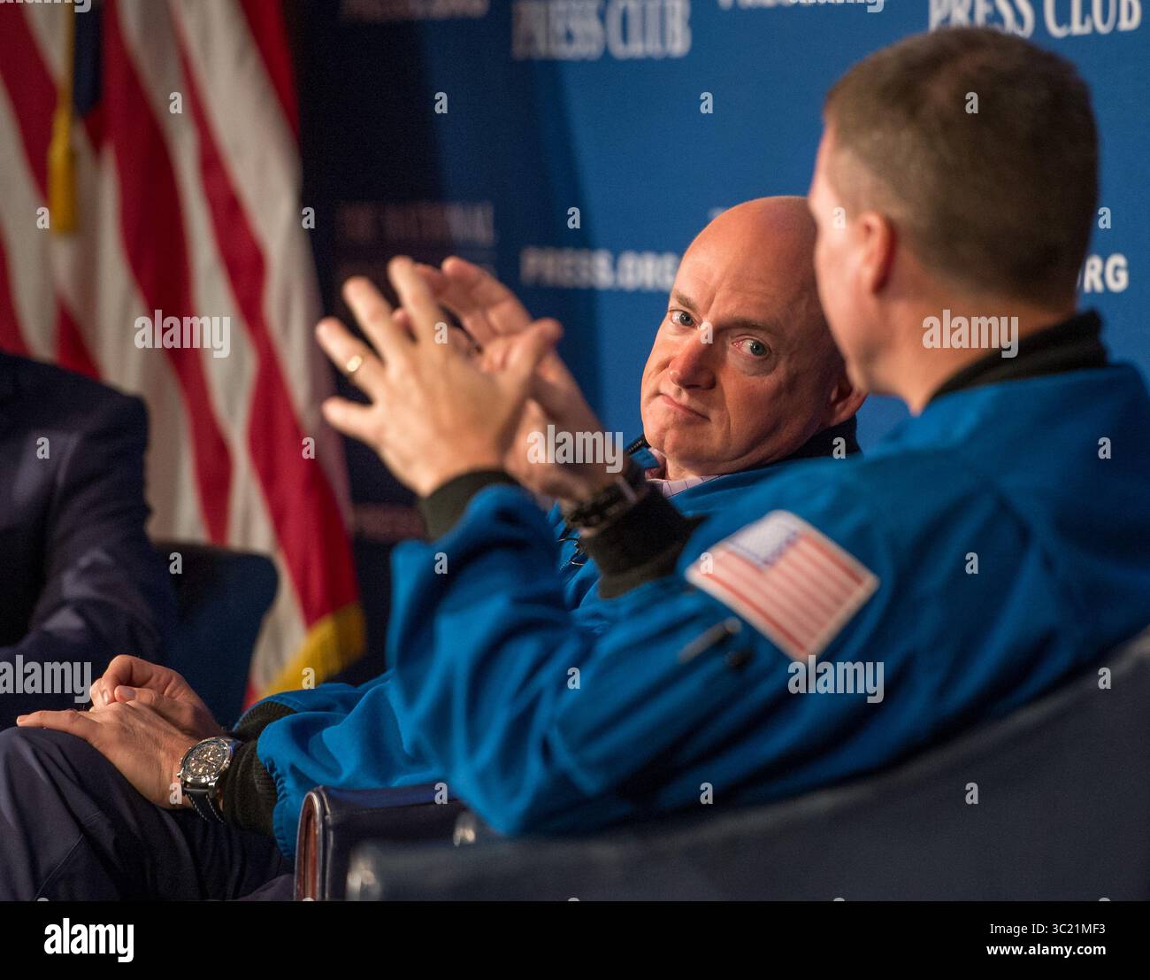 September 14, 2015 - Washington, DC, USA - Retired Astronaut Mark Kelly listens during a discussion with Astronaut Terry Virts, right, National Press Club President John Hughs, and Kelly's twin bother, Scott Kelly who is currently onboard the International Space Station, Monday, Sept. 14, 2015 at the National Press Club in Washington. The discussion is a day before Scott Kelly reaches halfway through his one year in space.  (Credit Image: © NASA/ZUMA Wire/ZUMAPRESS.com) Stock Photo
