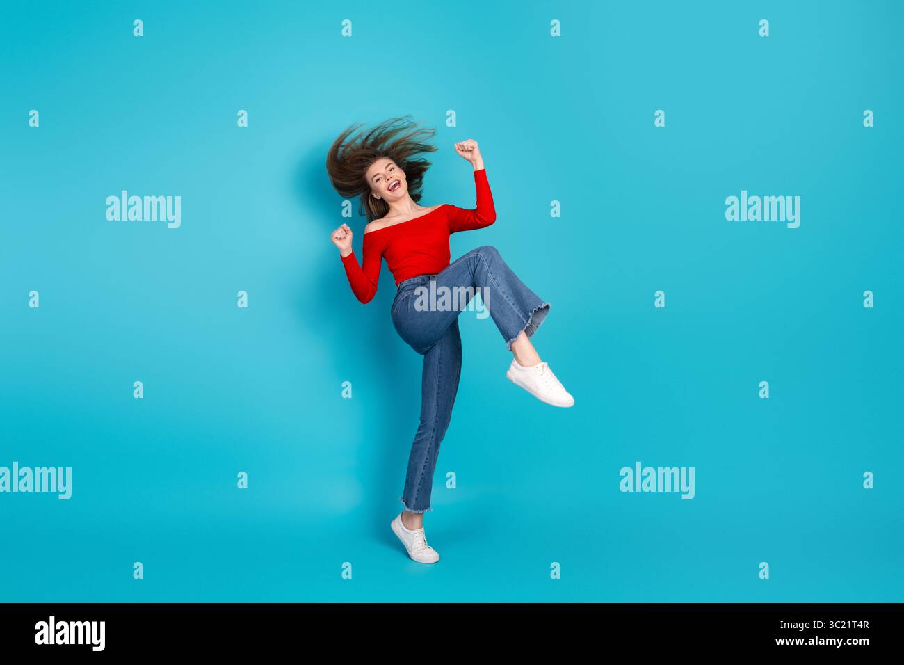 Wearing red top and blue jeans hi-res stock photography and images - Alamy