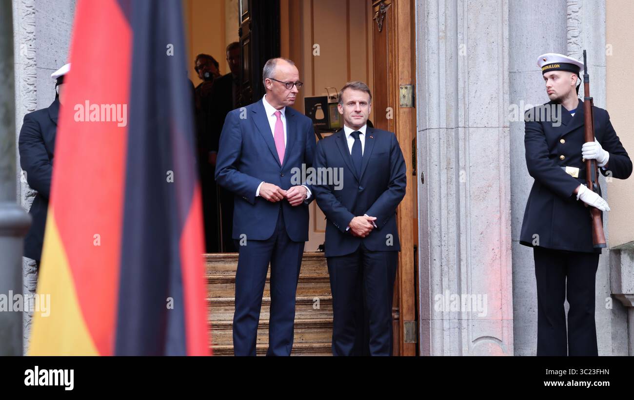 Berlin, Germany, 23th Juli 2025. Arrival of the President of the French Republic, Mr Emmanuel Macron (FRA), and welcome by Federal Chancellor Mr Friedrich Merz (GER) at Villa Borsig. Photo: Klaus Kroenert Credit: Klaus Kroenert/Alamy Live News Stock Photo