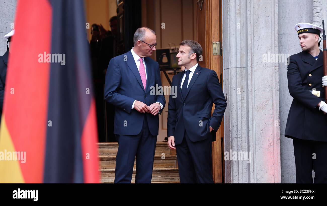 Berlin, Germany, 23th Juli 2025. Arrival of the President of the French Republic, Mr Emmanuel Macron (FRA), and welcome by Federal Chancellor Mr Friedrich Merz (GER) at Villa Borsig. Photo: Klaus Kroenert Credit: Klaus Kroenert/Alamy Live News Stock Photo