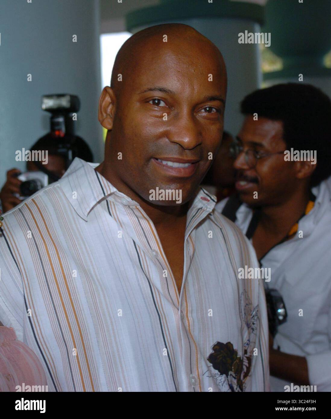 MIAMI - JULY 16: DirectorJohn Singleton and wife Akosua Busia at Film  Life's 8th Annual American Black Film Festival at The Jackie Gleason  Theater on July 16, 2005, in Miami, Florida. People:, image size:1098x1390