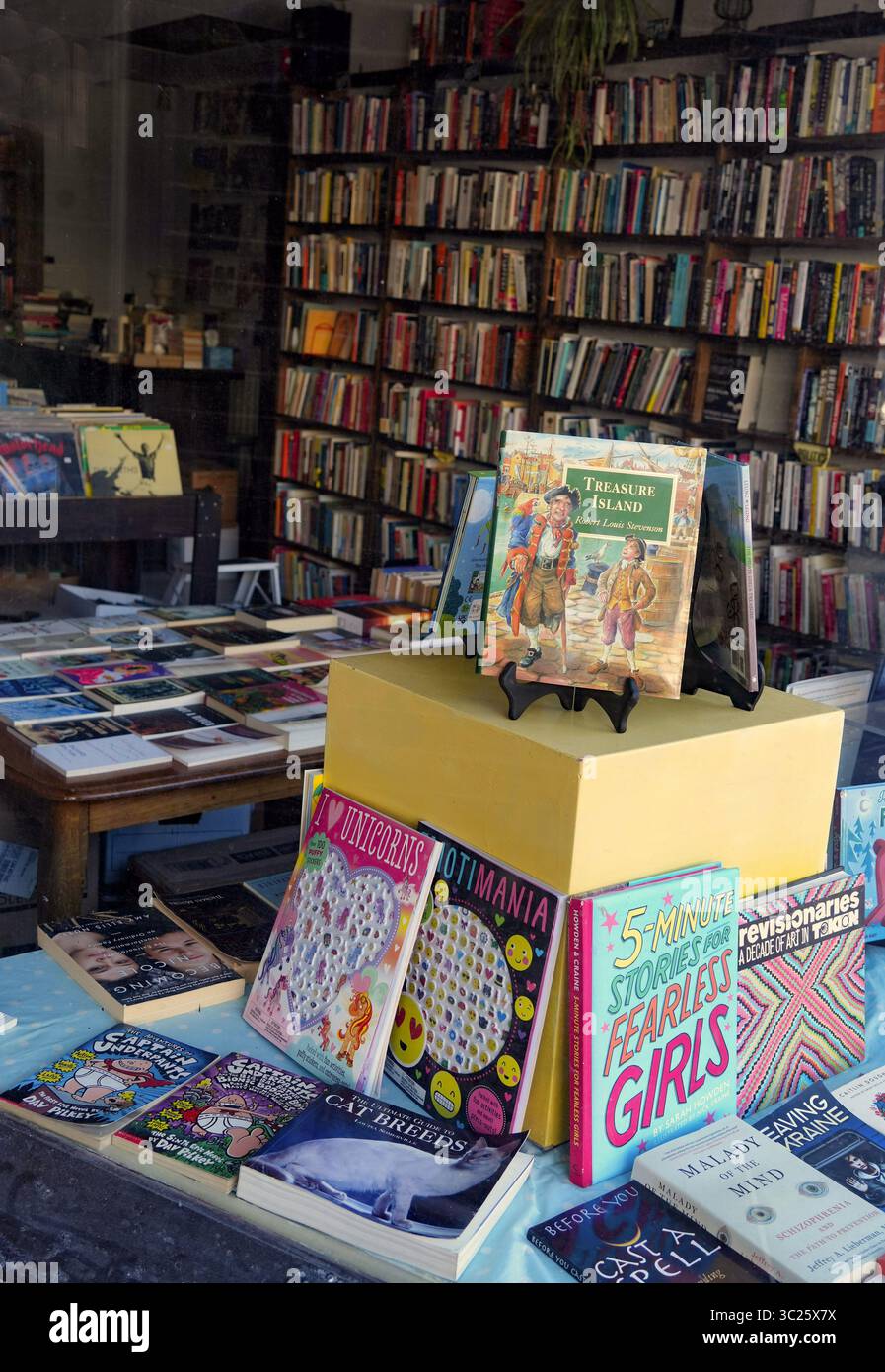 Bookstore with display of children's books, including Treasure Island Stock Photo