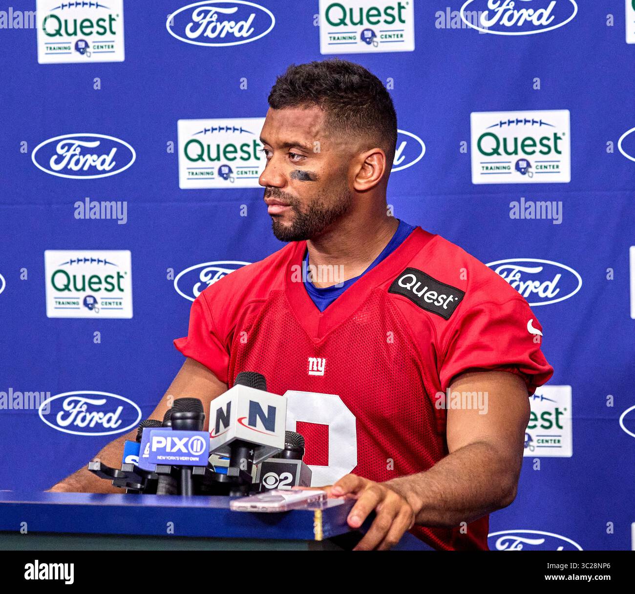New York Giants quarterback Russell Wilson (3) talks with media during ...