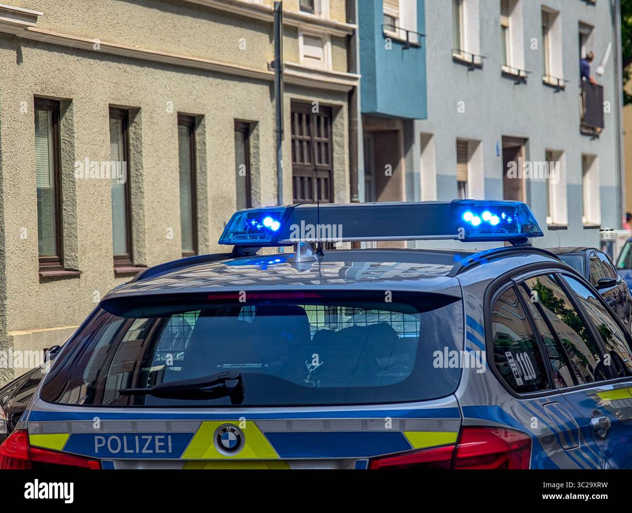 A German Police Car (rear View) With Flashing Blue Lights In Action On ...