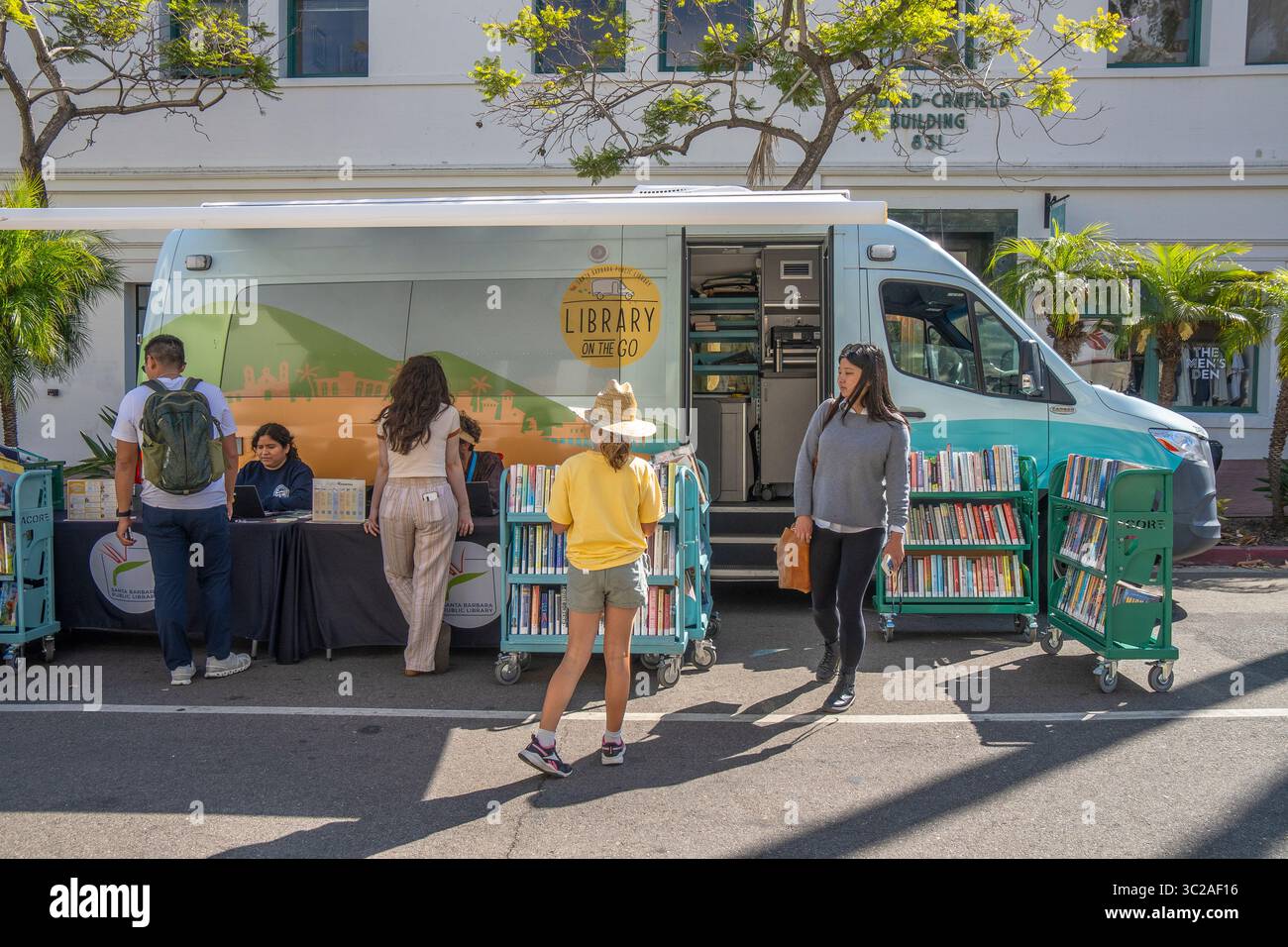 The 'Library on the go' from the Santa Barbara Library to bring books to people, especially kids. This library is at the Tuesday Farmer's Market. Stock Photo