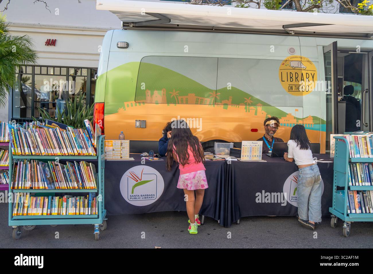 The 'Library on the go' from the Santa Barbara Library to bring books to people, especially kids. This library is at the Tuesday Farmer's Market. Stock Photo