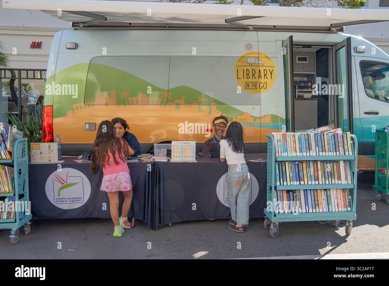 The 'Library on the go' from the Santa Barbara Library to bring books to people, especially kids. This library is at the Tuesday Farmer's Market. Stock Photo