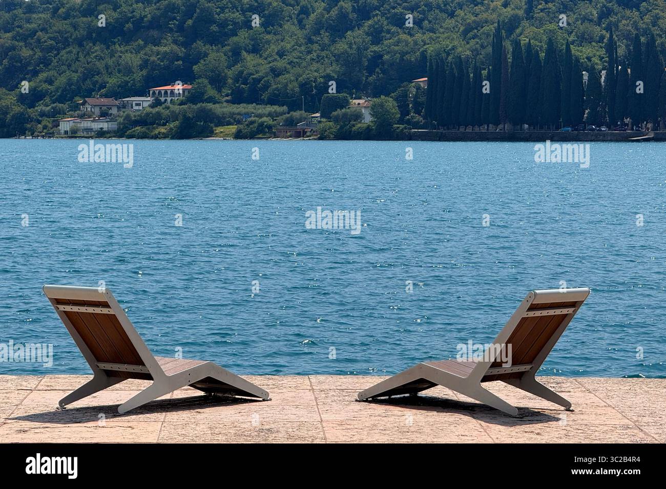 Reclining chairs on shore of Lake Garda at Salo, Italy - Smartphone Captured Stock Image
