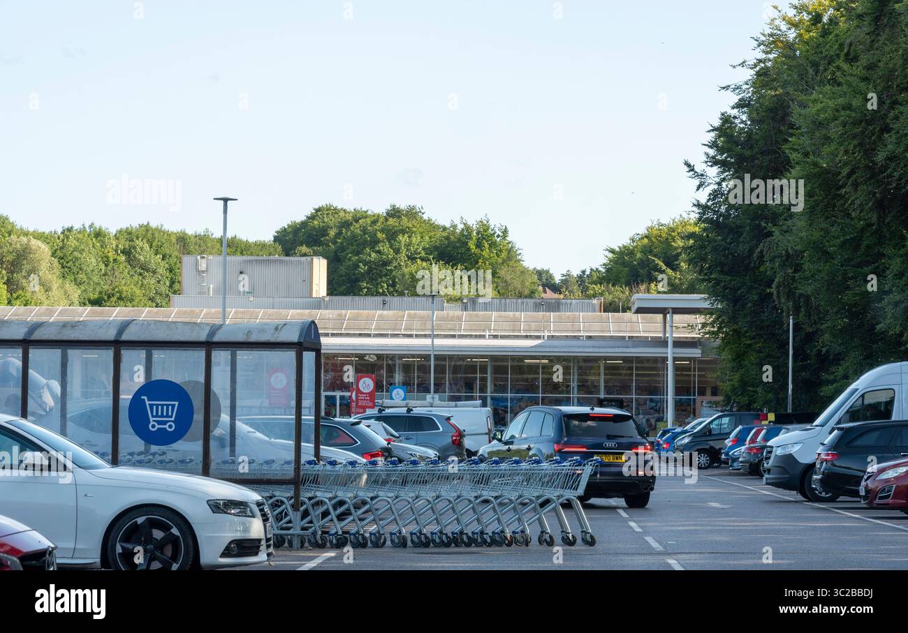 Winchester Hampshire England UK. 14.07.2025. Supermarket trollies stacked blocking the access road and car parking area. Stock Photo