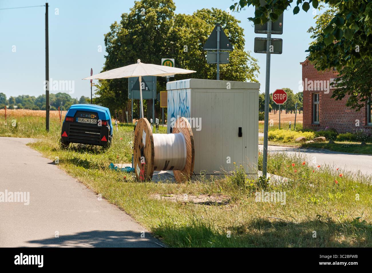 July 2, 2025 - Garz-Germany: Empty cable spool, compressor and umbrella ...