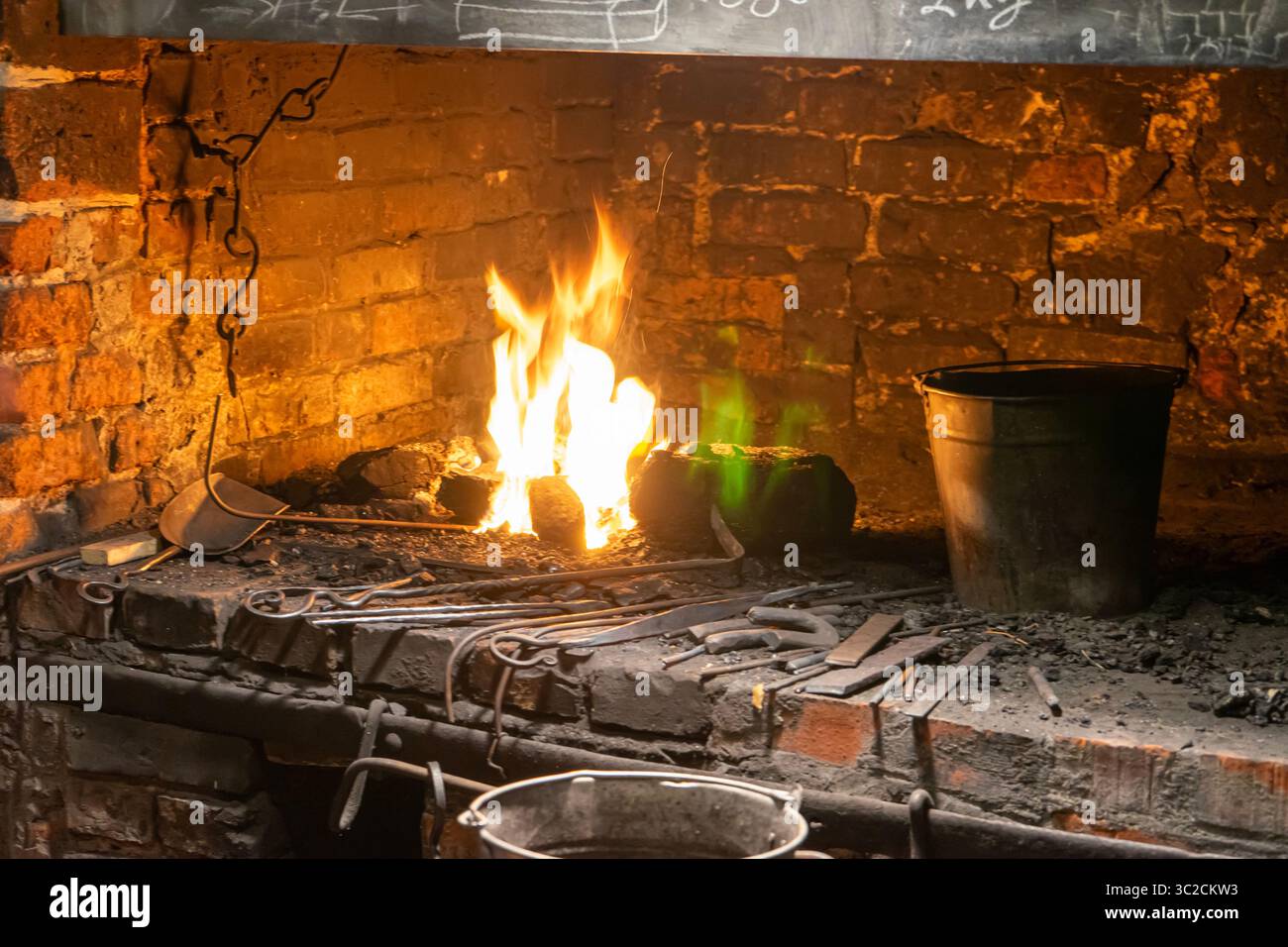 A master blacksmith at work, forging history with fire and steel in a ...