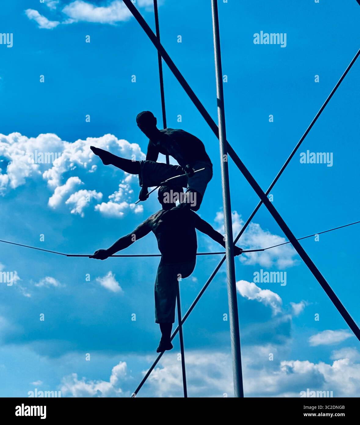 Father Bernatek’s Bridge is a Modern, pedestrianized river crossing adorned with sculptures of acrobats by artist Jerzy Kędziora in Kraków, Poland. - Smartphone Captured Stock Image