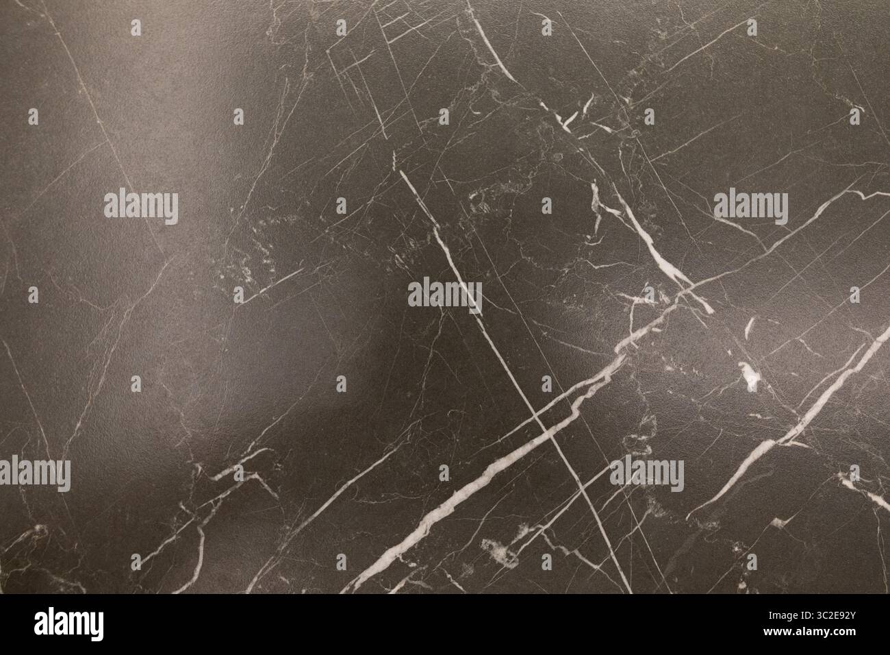 Dark marble surface featuring intricate white veining patterns creating an elegant backdrop for various decorative projects Stock Photo