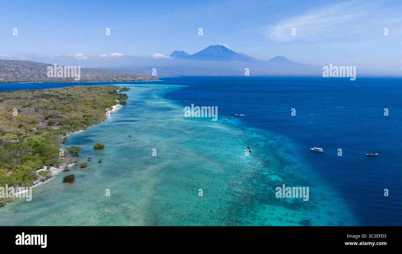 Aerial view of where the turquoise shallows meet the deep blue sea near ...