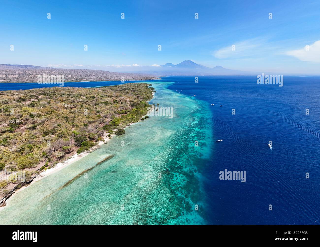 Aerial view of where the turquoise shallows meet the deep blue sea near ...