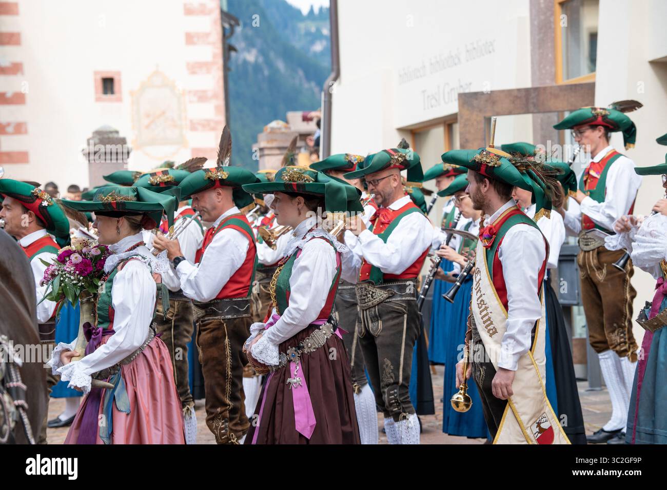 Group of men and women in town square wearing traditional tracht and dirndl  dress costumes during Ladin village summer festival in Val Gardena Stock  Photo - Alamy