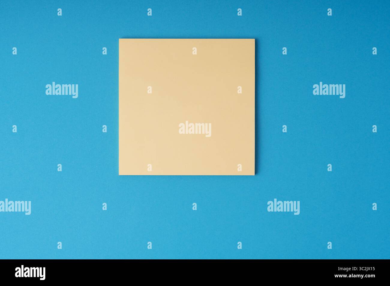 Blank adhesive note on blue background Stock Photo