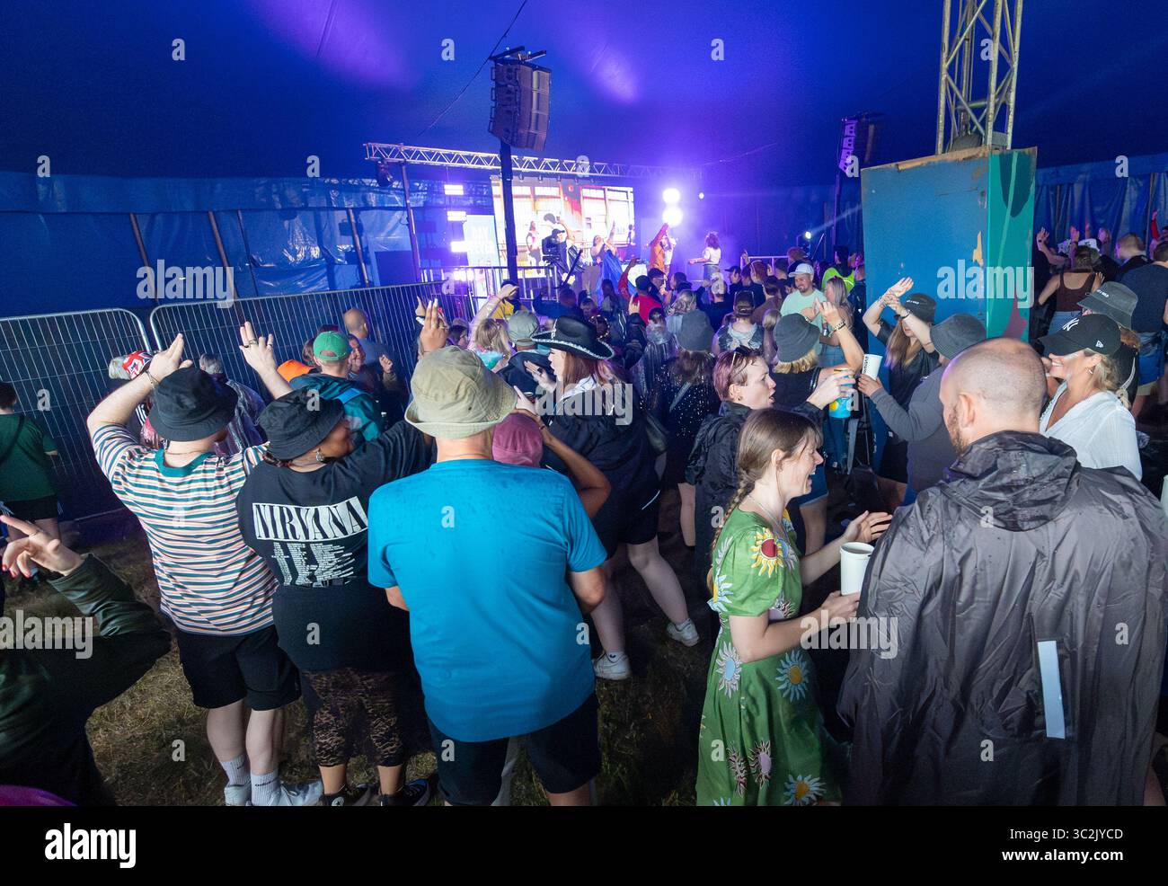 Festival fans enjoying the music at the Splendour Music Festival set the the historic grounds of Wollaton Hall on the out skirts of Nottingham. Stock Photo