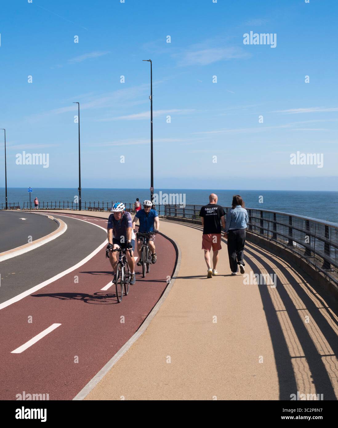 Walkers and cyclists using segregated cycle lanes and footpaths in ...