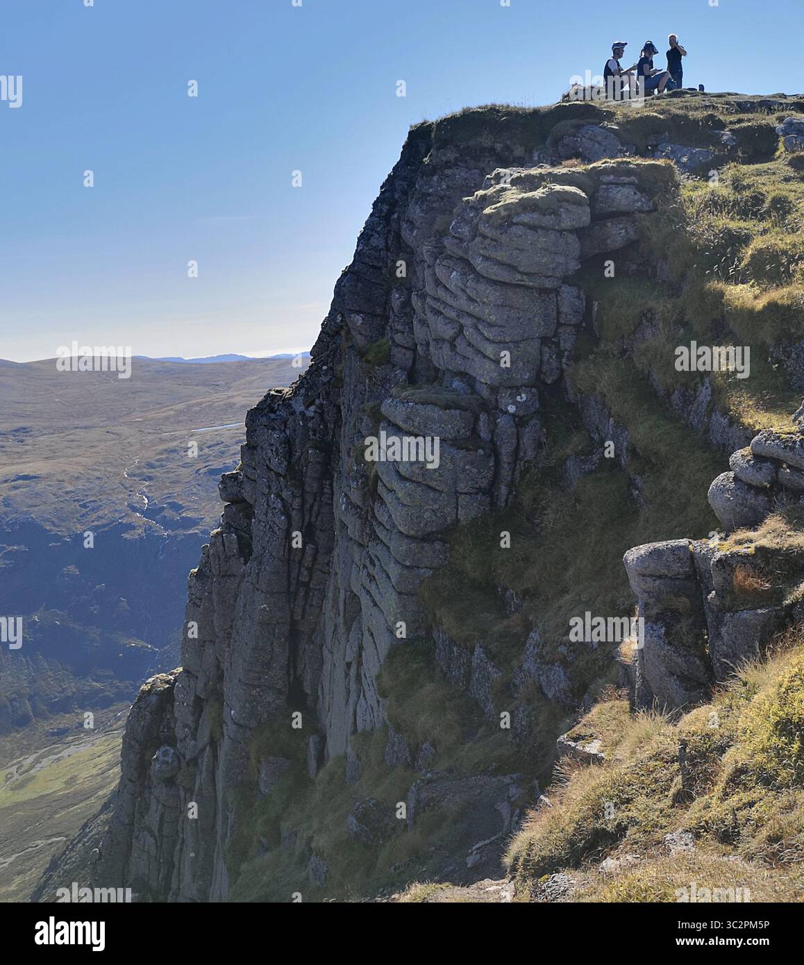 Summit of Sgòr Gaoith in the Cairngorm Mountains in Scotland. An easy Munro with dramatic views from the summit cliffs to Loch Einich and Braeriach. - Smartphone Captured Stock Image