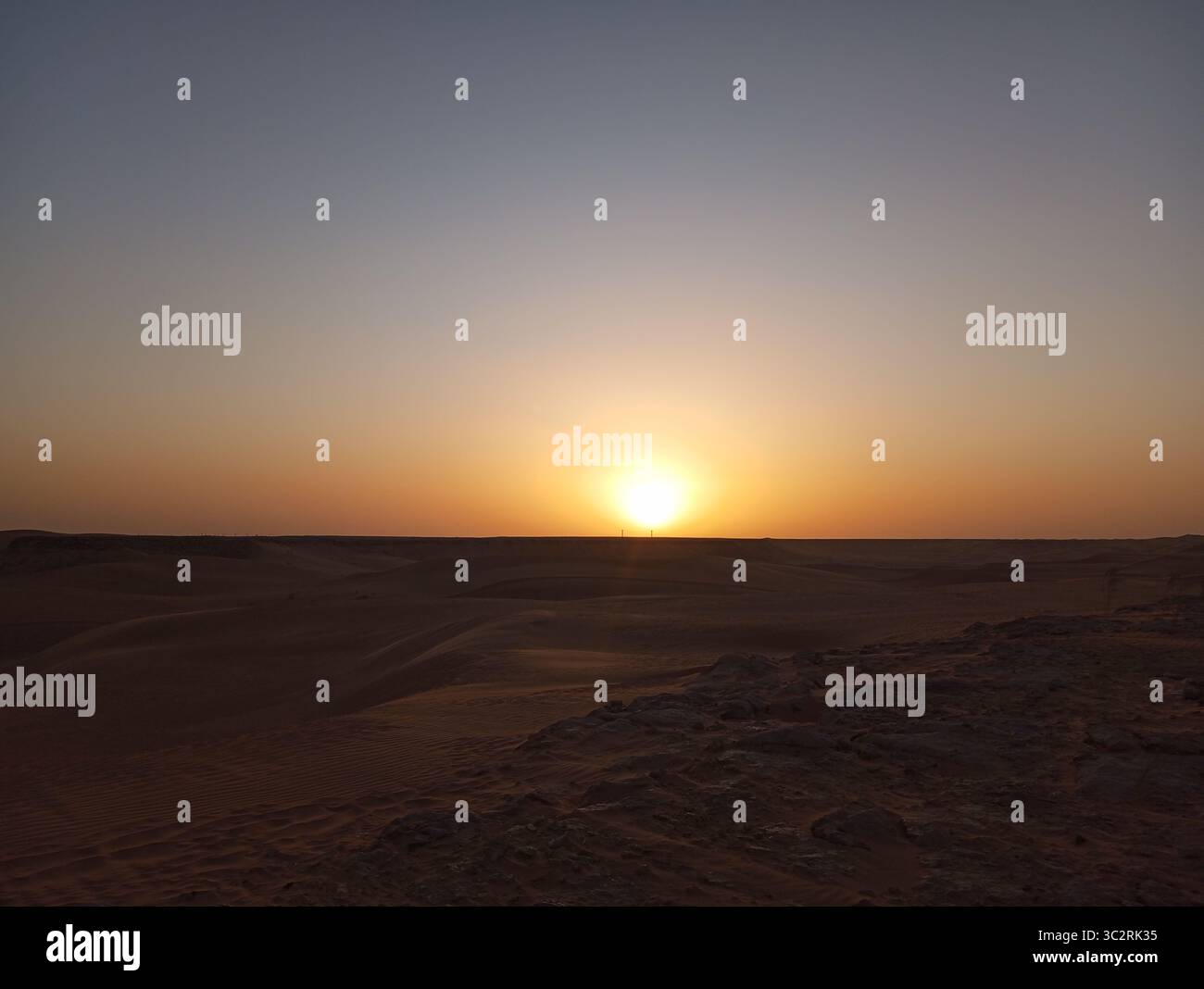 In the golden expanse of the Sahara, every grain of sand tells an ancient story. El Méniaa, a hidden gem of Algeria, reminds us of the wild beauty and - Smartphone Captured Stock Image