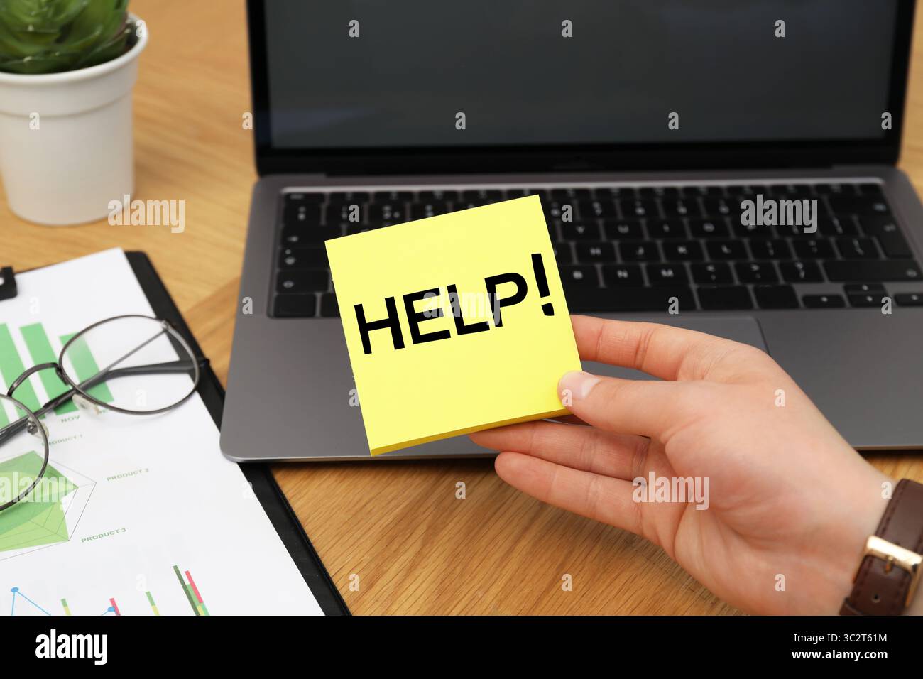 Man holding paper notes with word Help at workplace, closeup Stock Photo