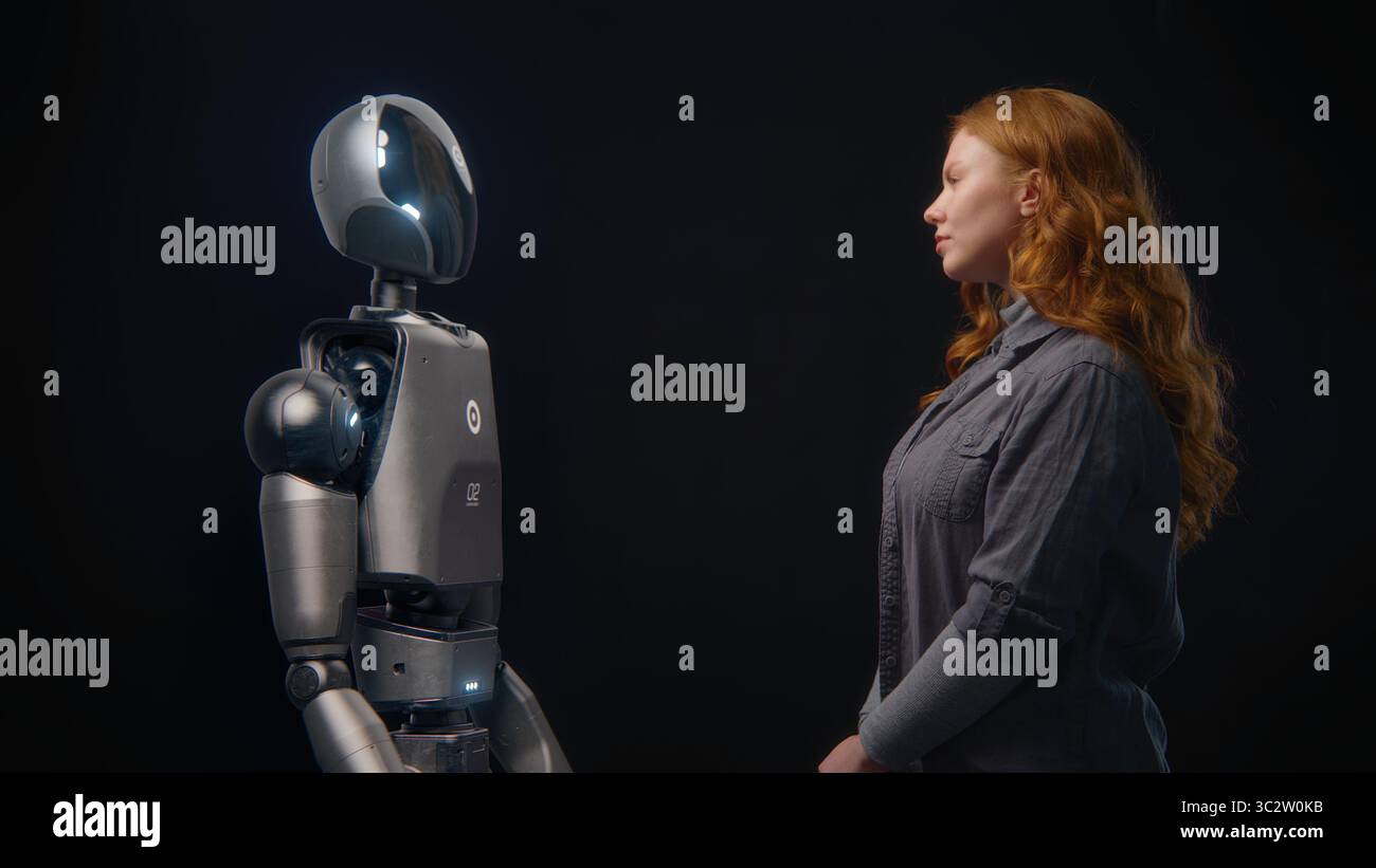 Futuristic Human-Machine Concept: Visualization of Young Woman Speaking with High-Tech Humanoid Robot. Symbol of Connection, Collaboration and Harmony Between Humanity and Artificial Intelligence. Stock Photo