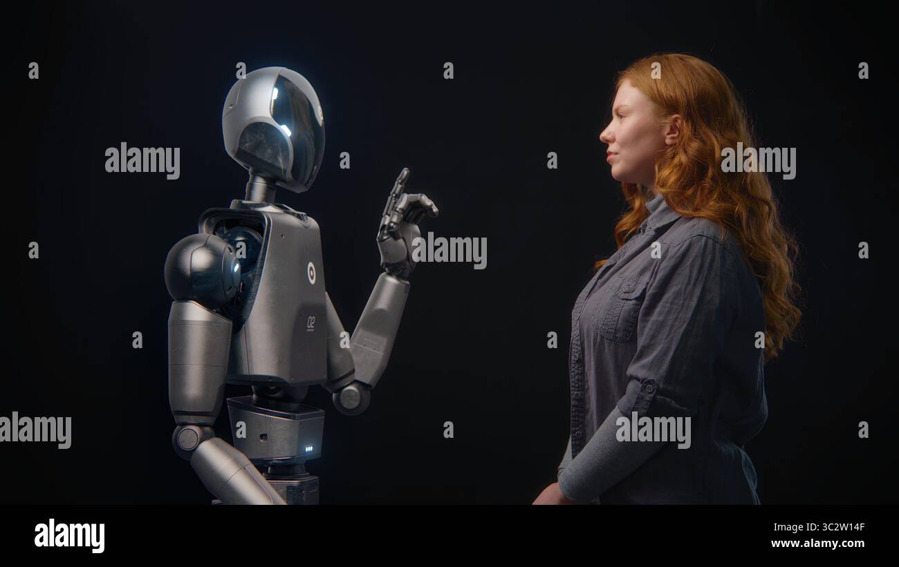 Futuristic Human-Machine Concept: Visualization of Young Woman Speaking with High-Tech Humanoid Robot. Symbol of Connection, Collaboration and Harmony Between Humanity and Artificial Intelligence. Stock Photo