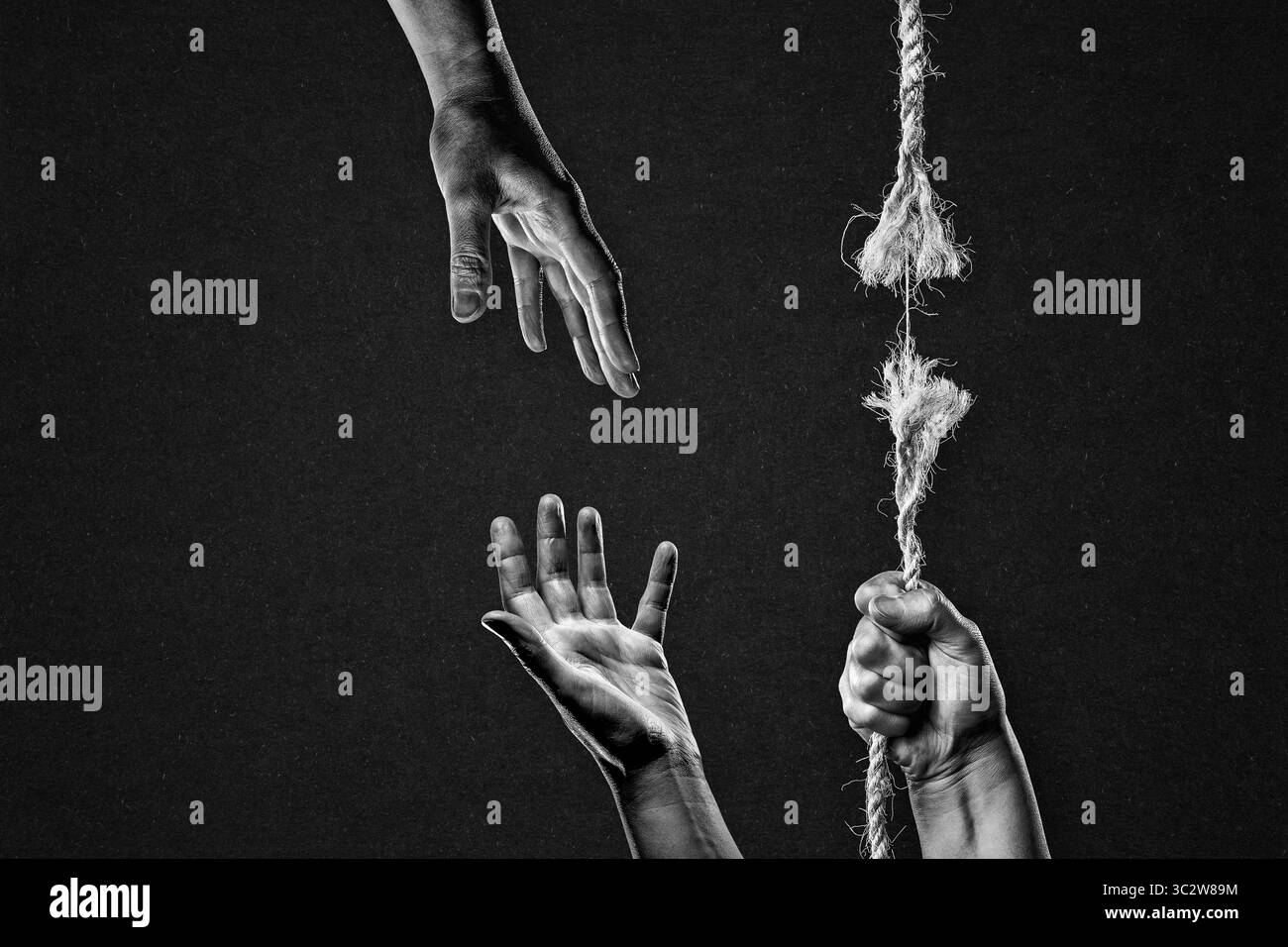 Hold on to Frayed Rope About to Break Asking for Help Each Other Against Textured Black Background Stock Photo