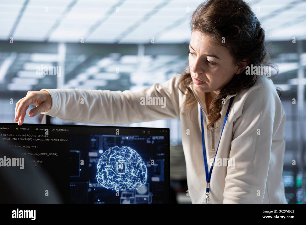 Manager overseeing worker doing data center automation using AI tools. Supervisor checking progress on employee integrating artificial intelligence driven automation in server hub operations Stock Photo