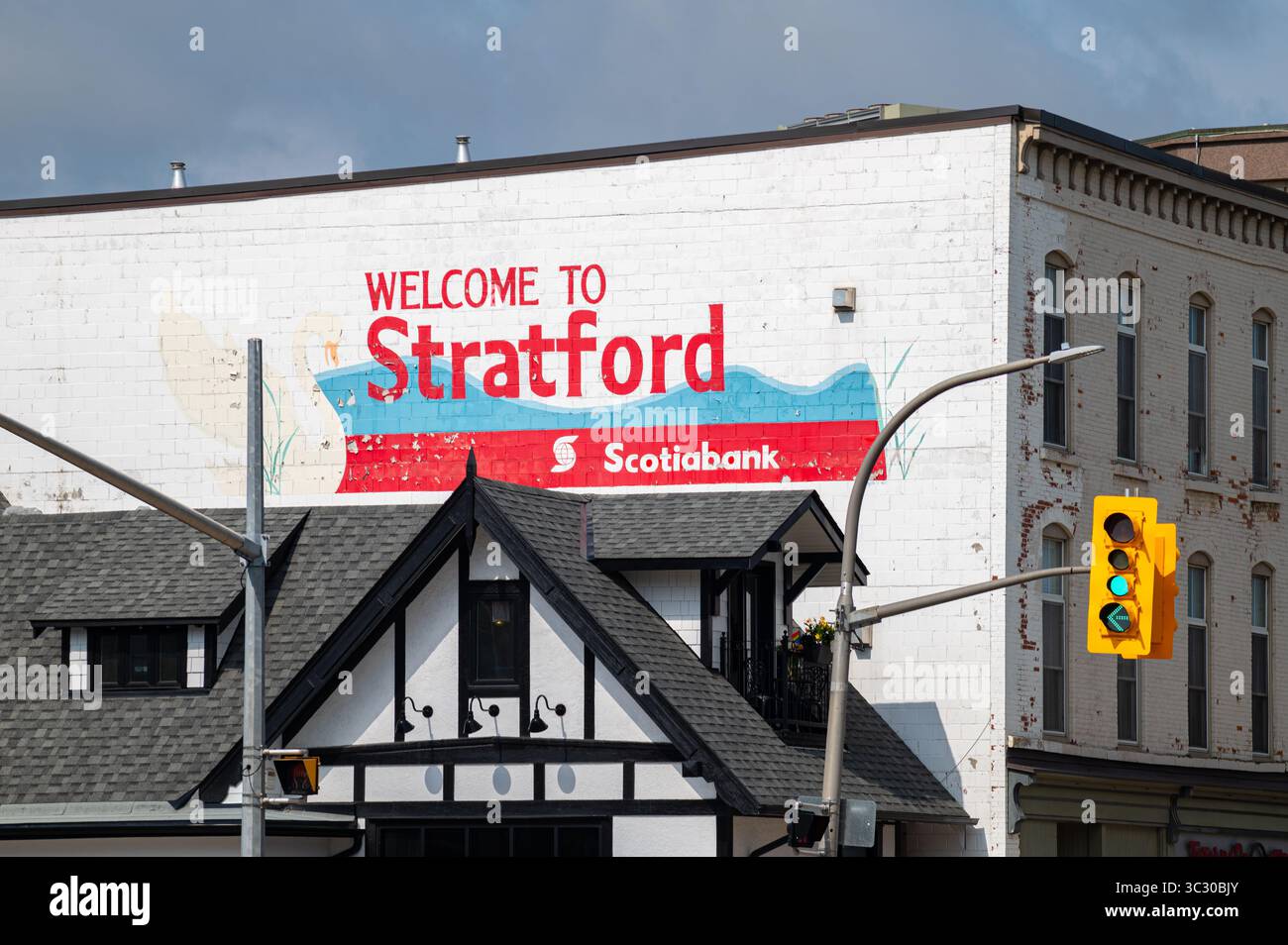 The Welcome to Stratford sign on the side of a Tudor-styled building in the downtown district of this town known for its theatre festival. Stock Photo