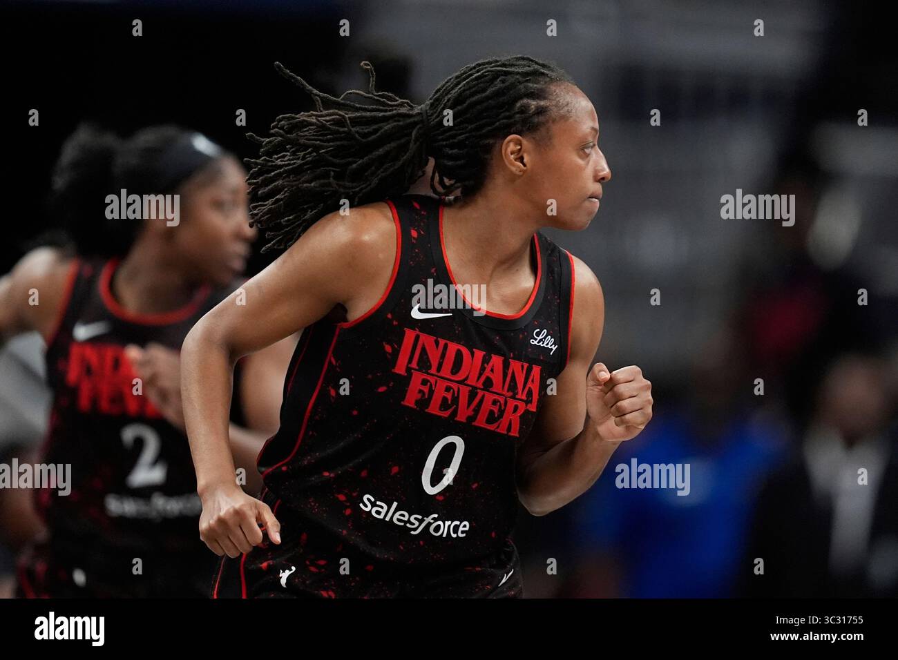 Indiana Fever's Kelsey Mitchell reacts after making a 3-point shot ...