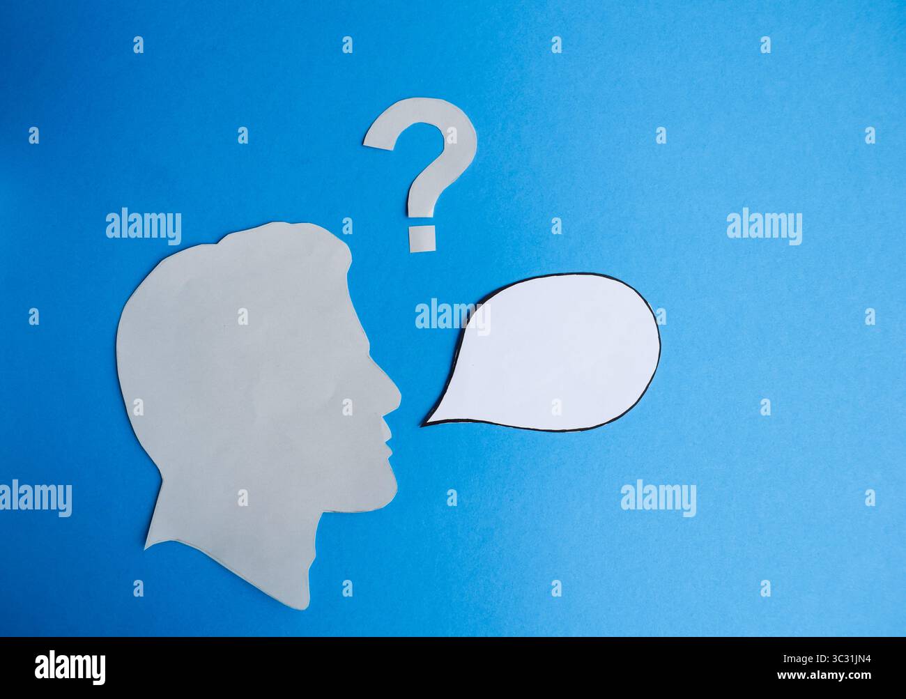 Human Head Silhouette with Blank Speech Bubble and Question Mark Stock Photo