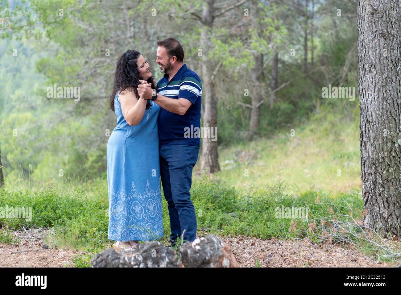 Woman in a blue shirt hi-res stock photography and images - Alamy