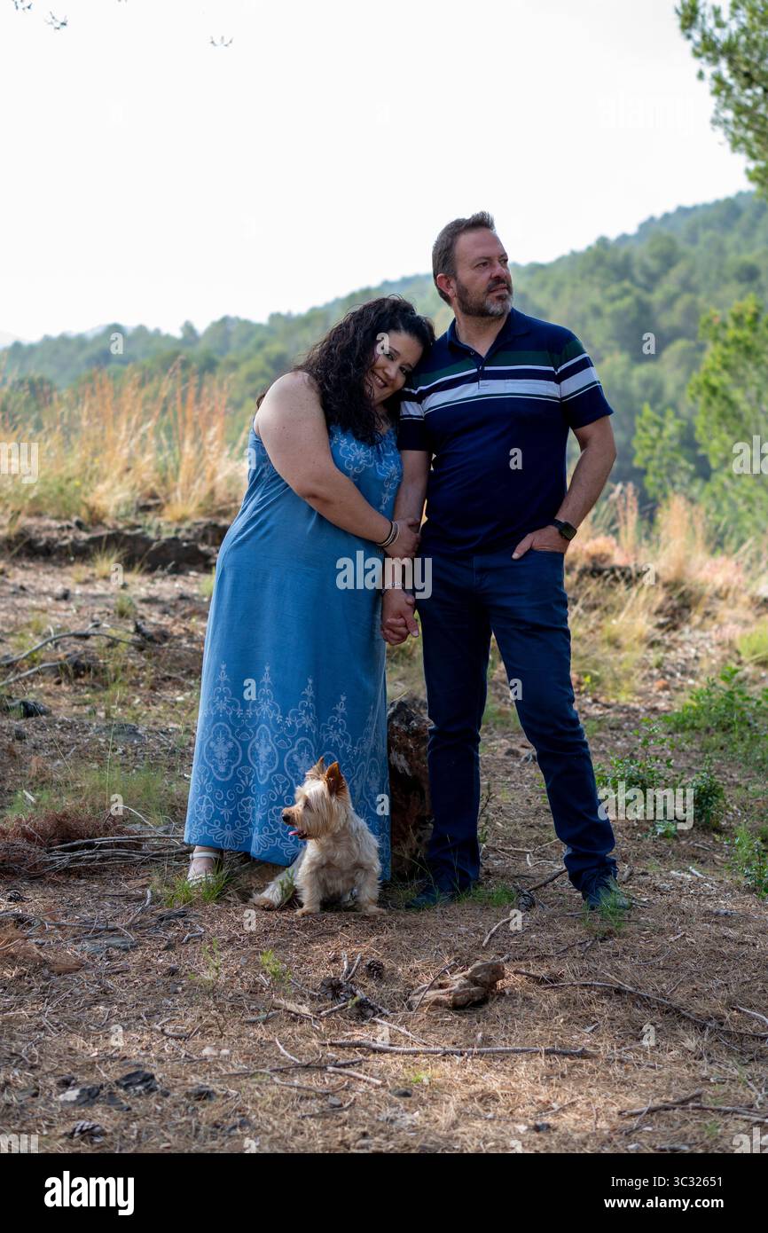 Standing woman in blue shirt hi-res stock photography and images - Alamy
