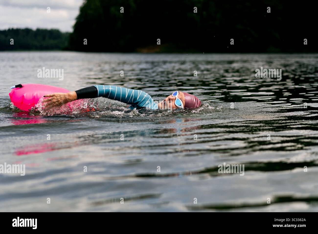 Athletic swimmers in open water hi-res stock photography and images - Alamy
