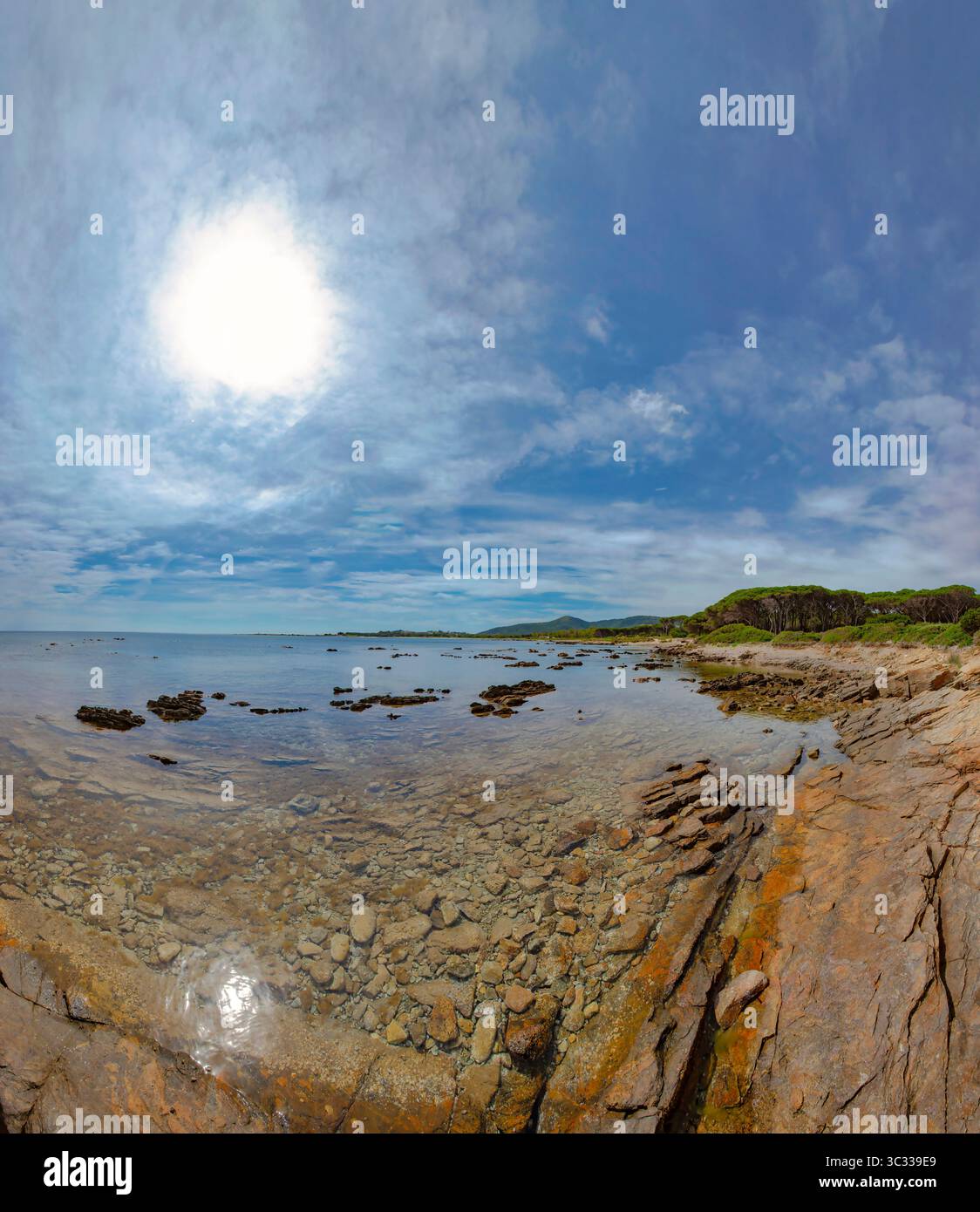 The crystal-clear seawater of Porto Ainu bay and beach Stock Photo