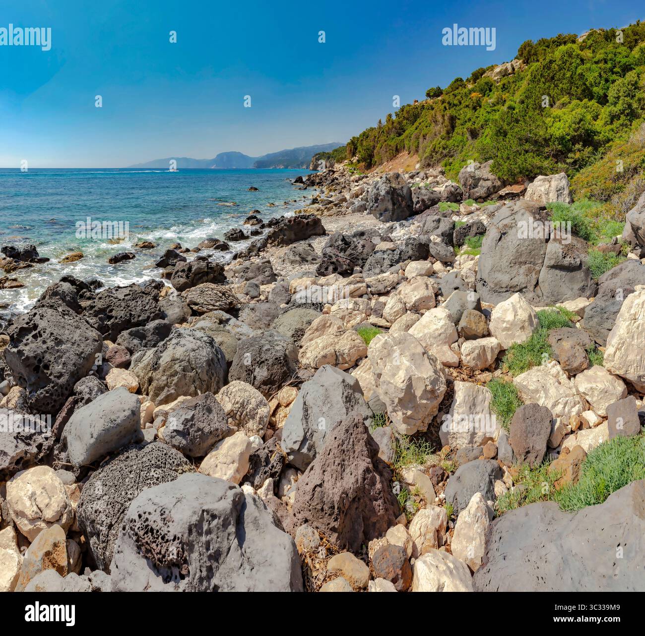 Beach full of rocks called Scorcio su Ziu Martine Stock Photo