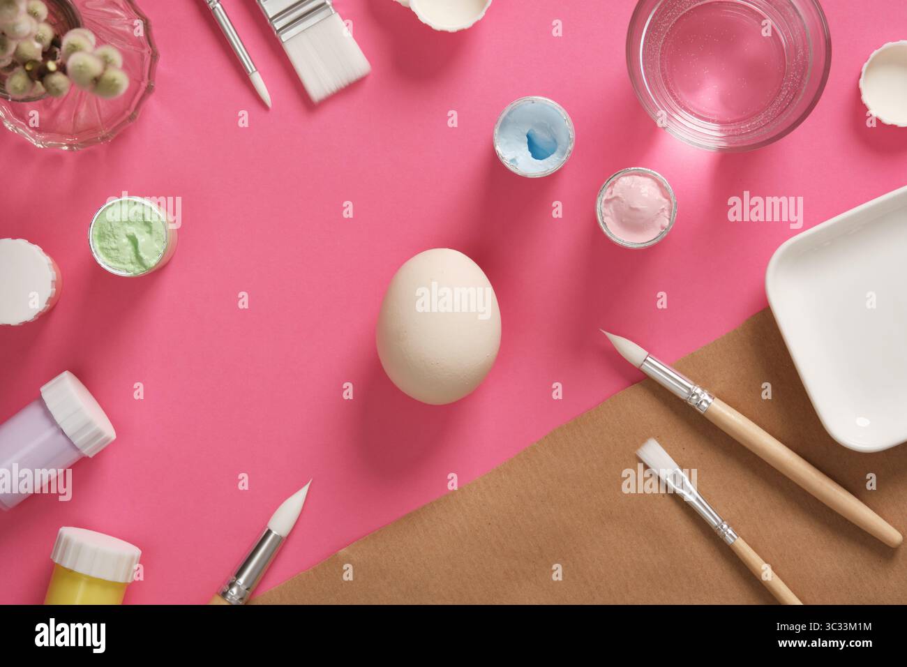 Preparing for Easter celebrations. Coloring Easter eggs with gouache. Clean light colored eggshells for your design. Stock Photo
