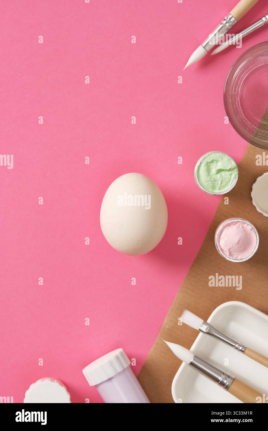 Preparing for Easter celebrations. Coloring Easter eggs with gouache. Clean light colored eggshells for your design. Stock Photo