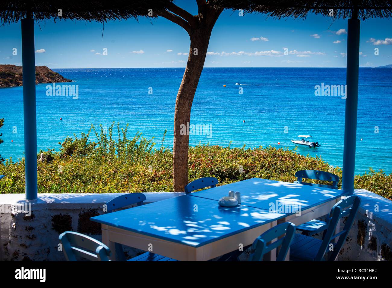 View from the Philosophia Beach Restaurant, Pefkos - Lindos, Rhodes, Greece looking out to sea (landscape orientation) Stock Photo