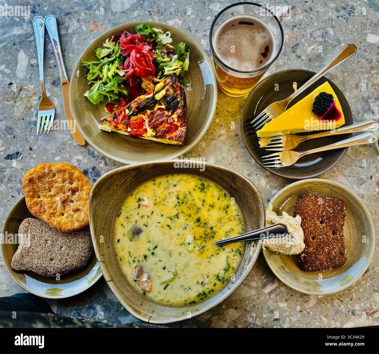 A bowl of traditional smoked reindeer soup with dark Finnish bread. - Smartphone Captured Stock Image