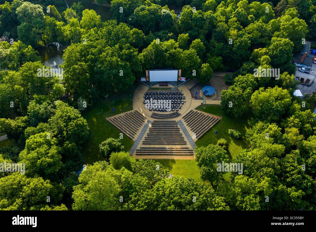 Aerial view of an open-air amphitheater nestled among lush green trees, a  stage set against the backdrop of nature's vibrant hues,  Friedrichshain-Kreuzberg, Berlin, Volkspark Friedrichshain, Germany Stock  Photo - Alamy