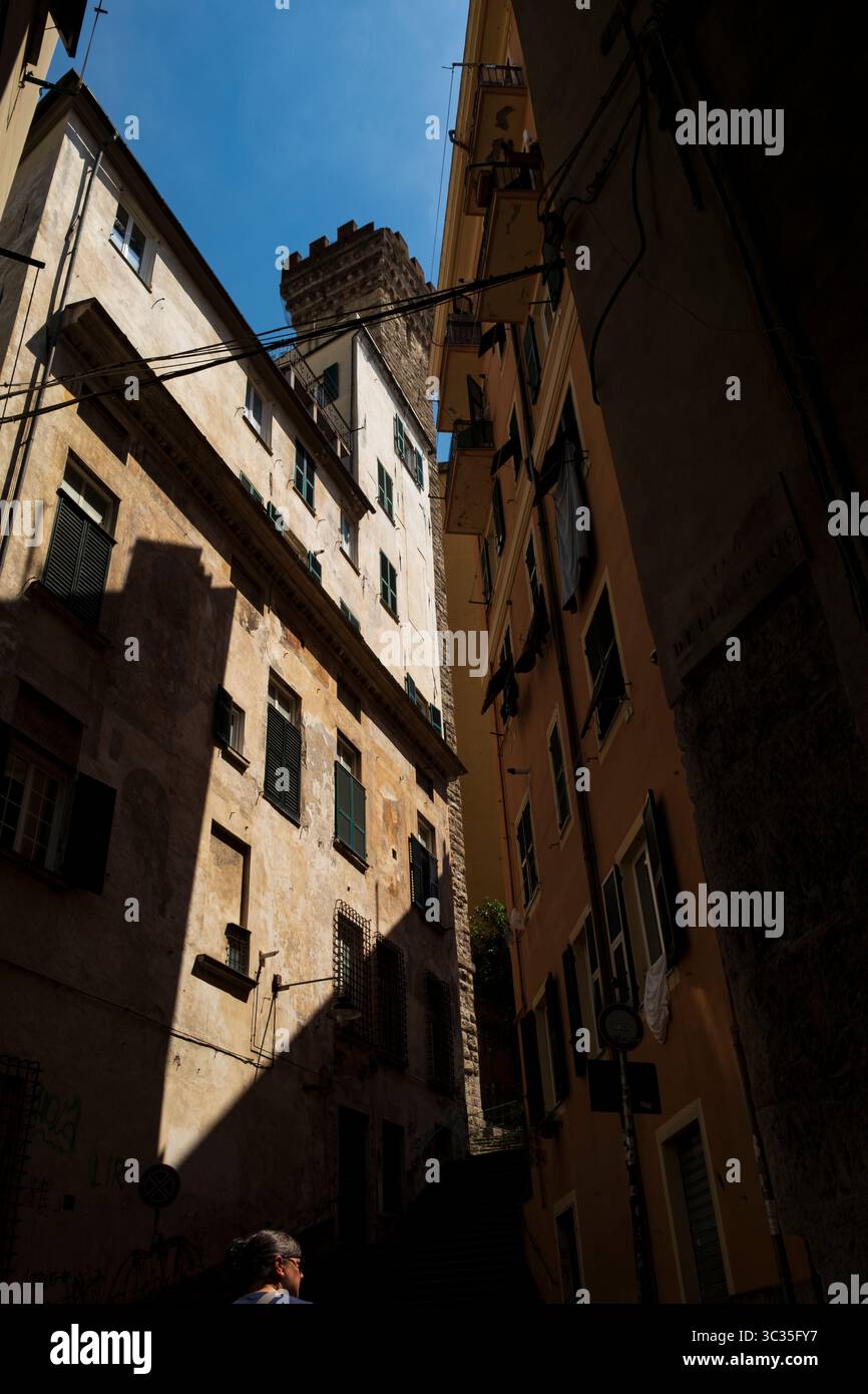 Sunlight and deep shady streets in Genoa, Italy Stock Photo