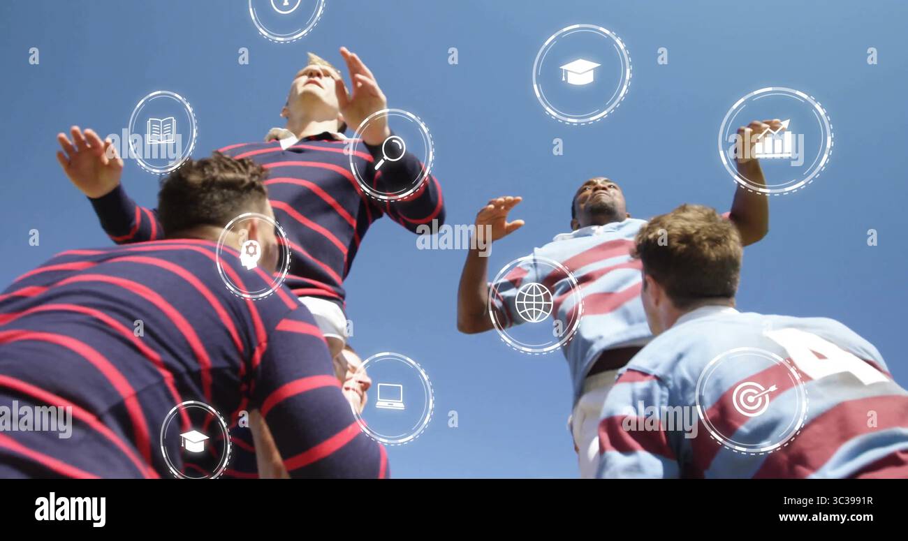 Teammates lifting rugby players in jerseys in lineout on rugby field ...