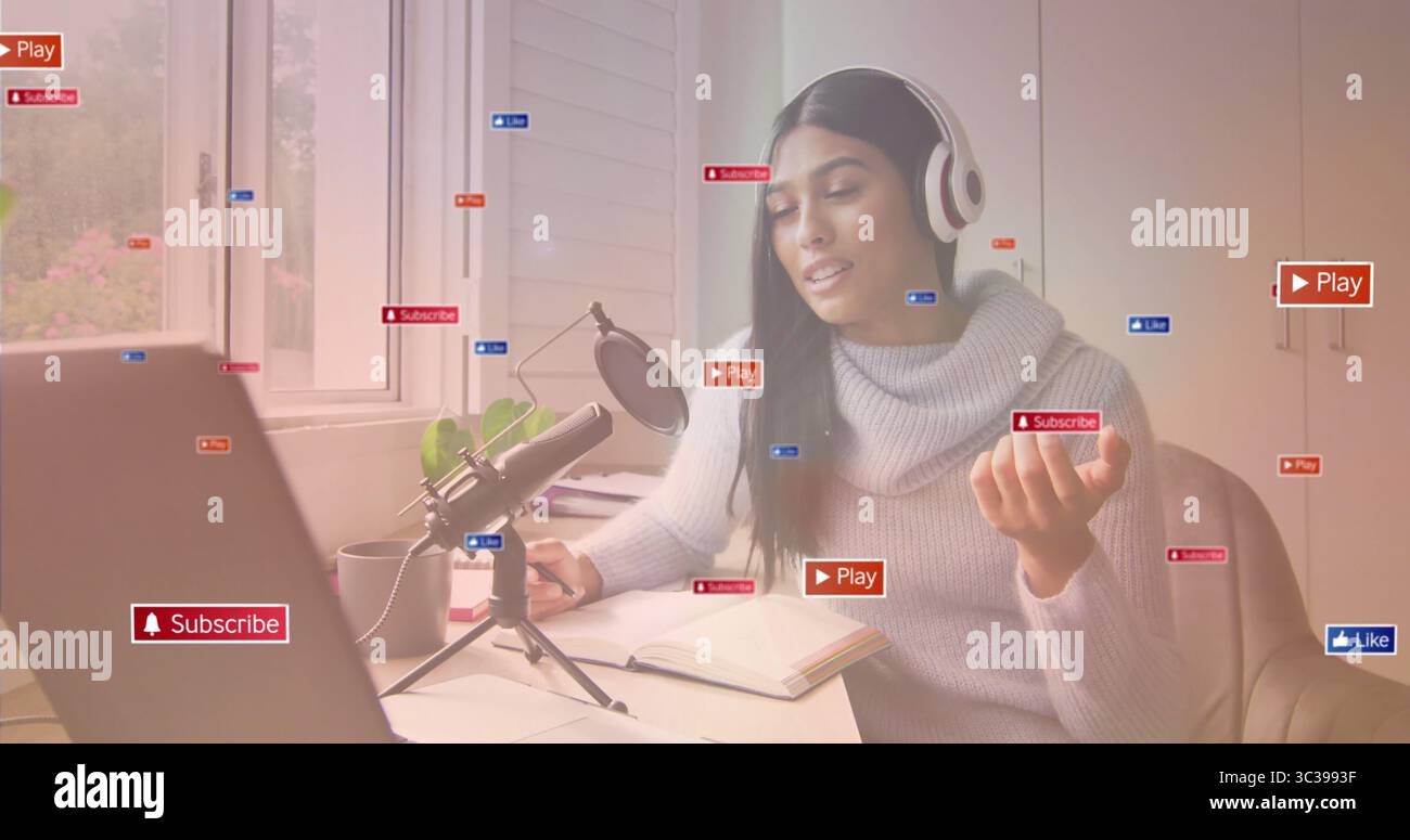 Recording content creator talking at office desk with laptop mic ...