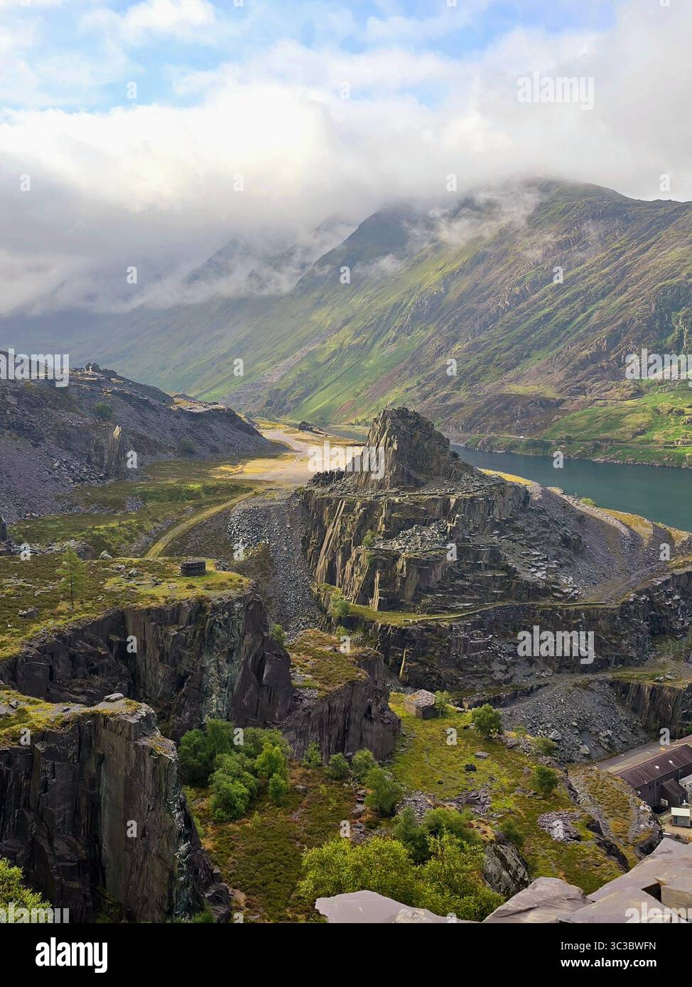 Abandoned Dinorwic Slate Quarry with Mountain Backdrop, Snowdonia, Wales. - Smartphone Captured Stock Image
