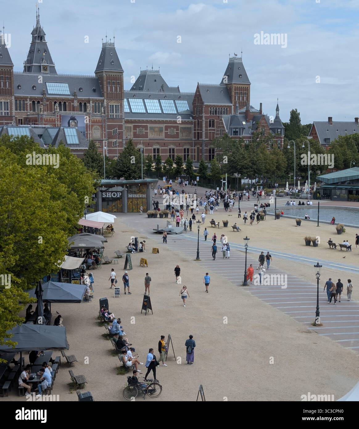 View of the Rijksmuseum and plaza from the Moco Museum. Museumplein (Museum Square) in Amsterdam includes the Rijksmuseum. Stock Photo